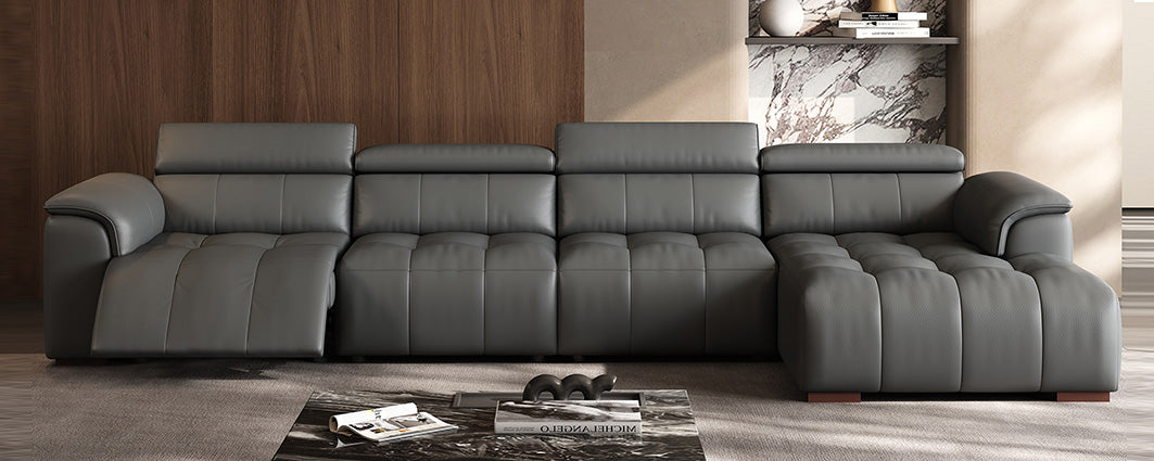 Grey sectional sofa with leather upholstery and adjustable headrests in living room